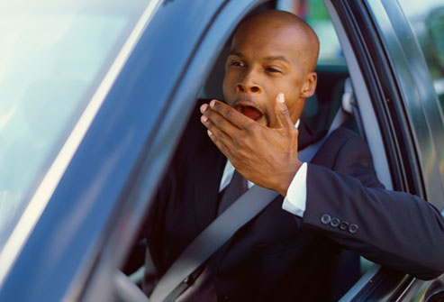 getty_rf_photo_of_man_yawning_while_driving